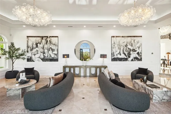 Soaring Ceilings with Gallery Walls were utilized by the designer for custom art curated for each room.
