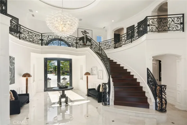 The ascending custom staircase from level w formal entry to the gallery level.