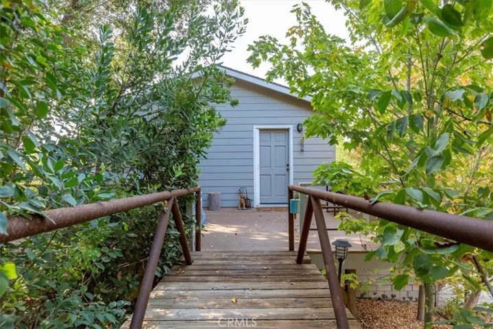 Walk down a bridge from the driveway or main house