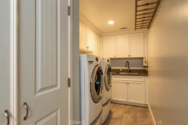 Laundry room next to garage