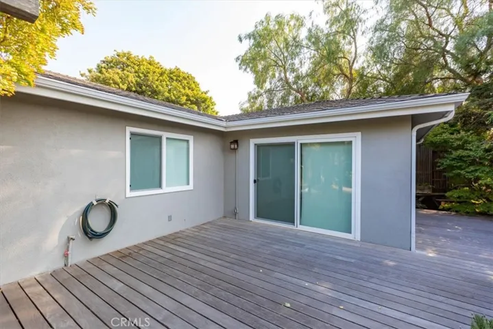The large deck off the back of the main house. The slider goes to the primary bedroom.