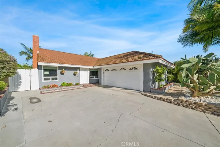 The home’s meticulously landscaped front yard enhances the curb appeal, making a lasting impression on all who visit