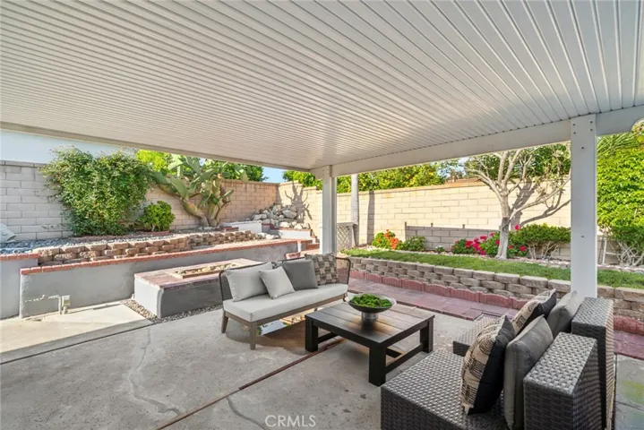 Step outside into your private backyard, where you'll find a charming patio area perfect for alfresco dining or relaxation