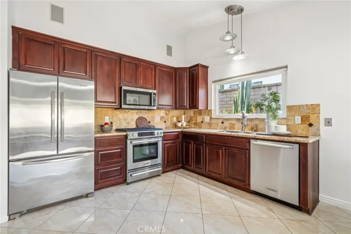 including gorgeous new cabinets, sleek countertops & updated appliances