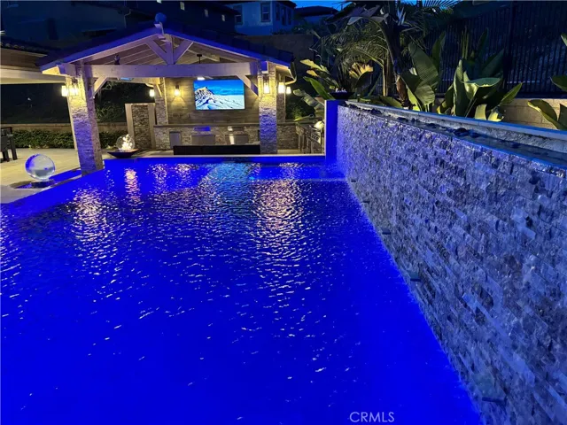 2 waterfalls on travertine walls.