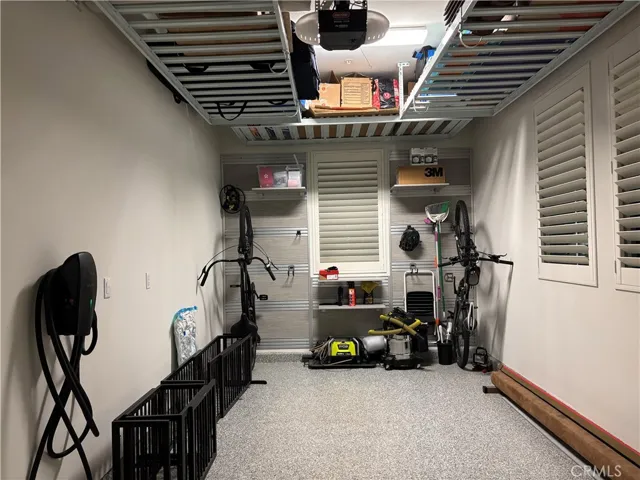 2nd electric charge, storage rack, & slatewall hanging system in the single garage.