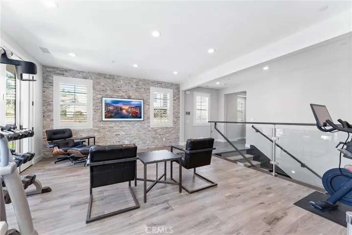 A loft with travertine stacked stone wall.
