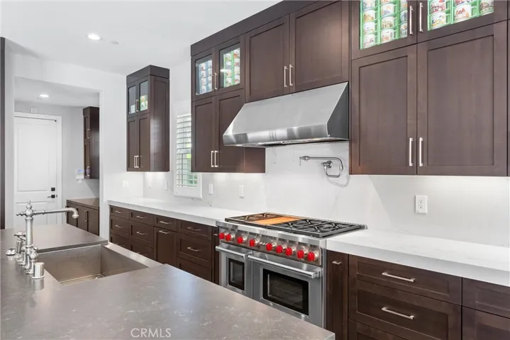 48" Commercial grade stove/oven and hood by Wolf.