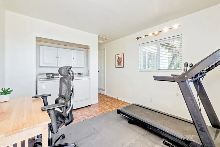This is the 4th bdrm currently used as an office/workout/laundry rm. Sellers added laundry hookups in the closet and installed a washer/dryer. There are laundry hookups in the garage - laundry can return there & closet doors added. see virtual rendering