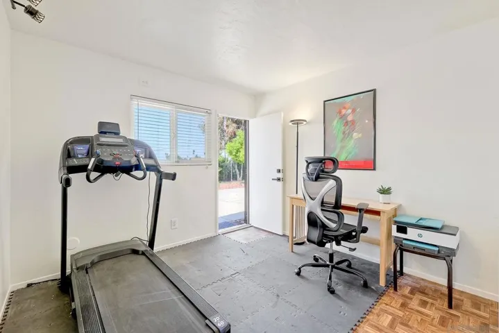 This is the 4th bdrm currently used as an office/workout/laundry rm. Sellers added laundry hookups in the closet and installed a washer/dryer. There are laundry hookups in the garage - laundry can return there & closet doors added. see virtual rendering