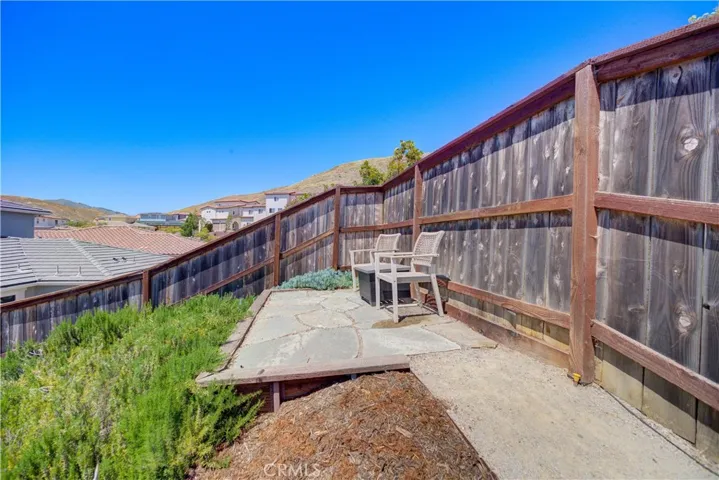 Sitting area in upstairs level out back offers scenic views.