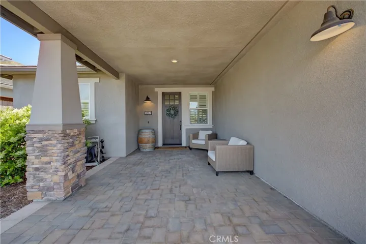 Oversized covered entryway with lights, perfect for extra entertaining space.