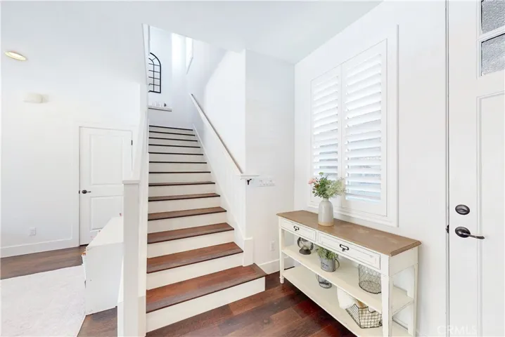 Modern stairwell with a cozy nook at the landing.