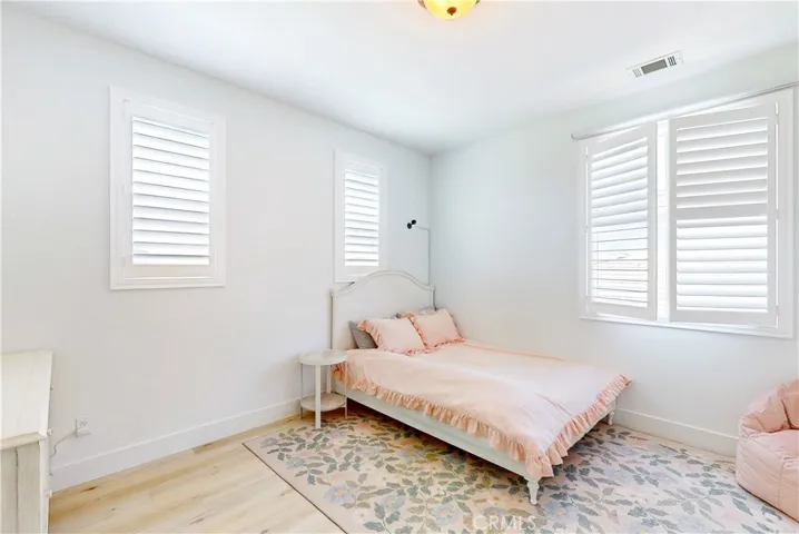 Upstairs Bedroom 3 is spacious and filled with natural light from front-facing windows.