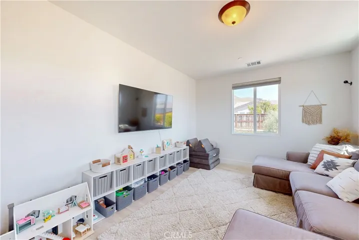 Upstairs bedroom #1 offers scenic views through the backyard.