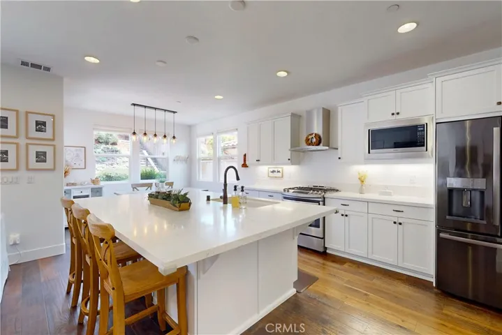 Kitchen with stainless steel appliances and clean modern cabinetry.