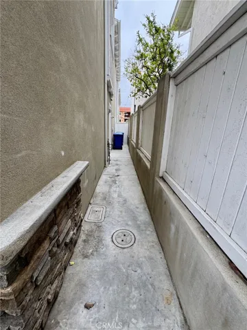 Side yard with door to garage