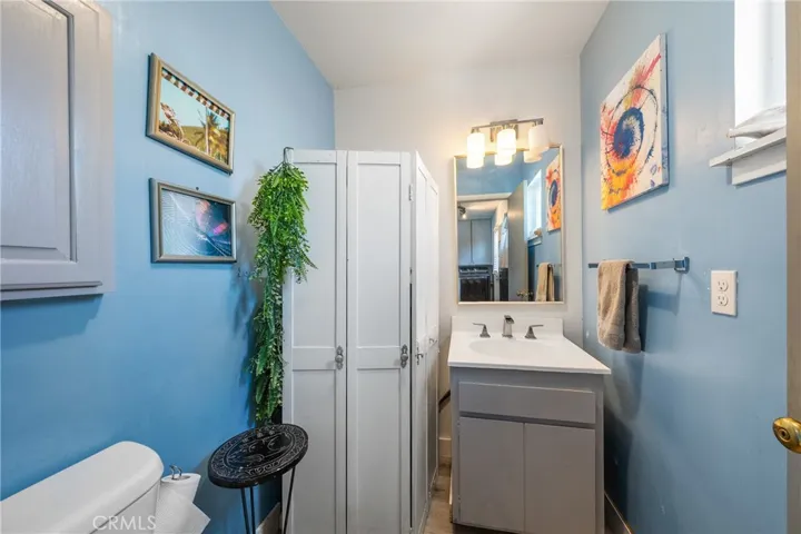Half bath off utility room for easy access from back patio