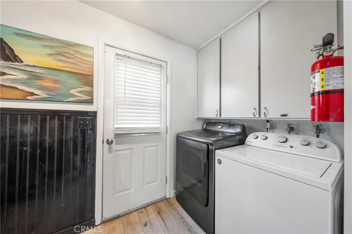 Utility room with door to side yard