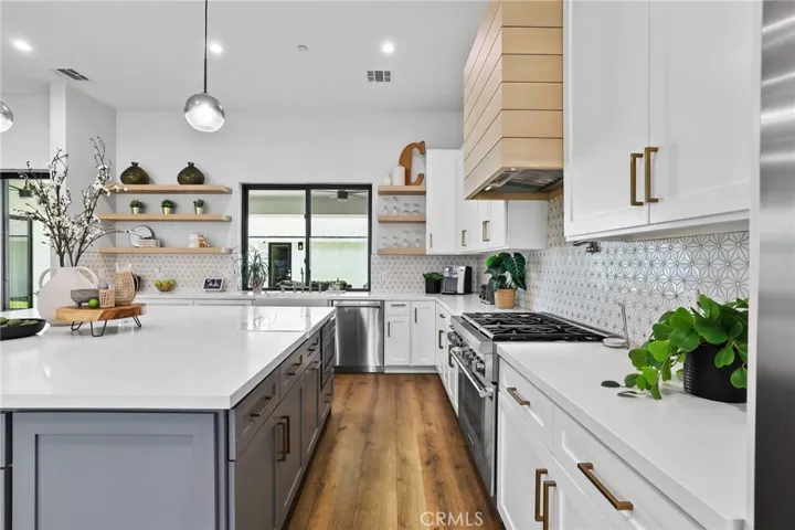 Designer Details – From the tile backsplash to custom cabinetry, every detail in this kitchen was chosen for both style and utility.