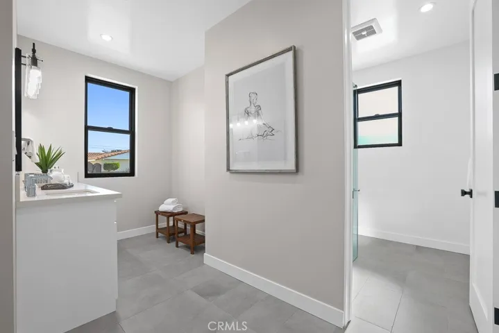 This hallway nook offers the perfect blend of form and function—ideal for a gallery wall, reading corner, or additional storage space.