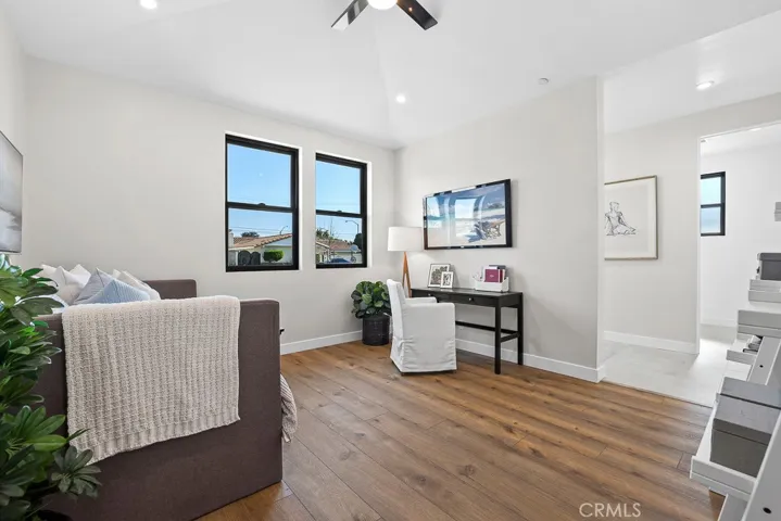 Spacious and serene, this guest suite features beautiful flooring, expansive windows, and a peaceful ambiance for restful nights.