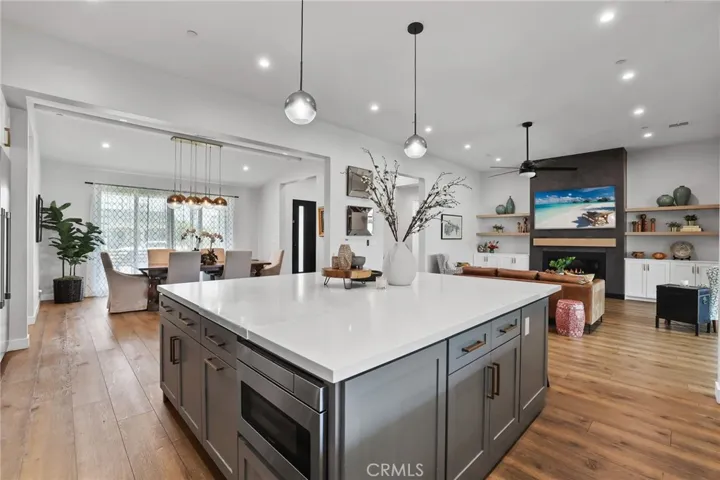 Kitchen Envy – Dual-tone cabinets, stone counters, and an oversized island elevate every meal and celebration.