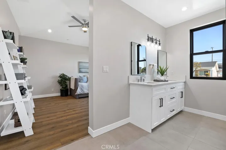 Charming laundry room with ample counter space, built-in storage, and a modern aesthetic—designed to make laundry day a little more enjoyable.
