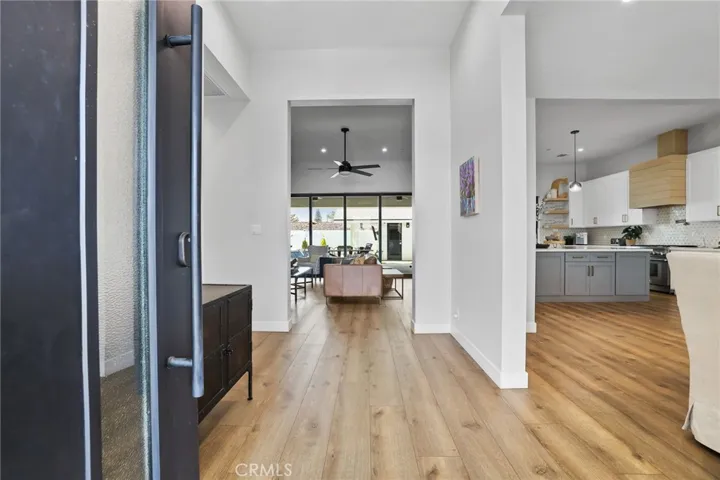 Grand First Impression – Step inside to warm wood floors, custom finishes, and a seamless flow that invites you home.