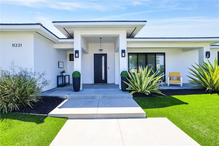Elegant Entryway – A bold and contemporary front façade with designer landscaping sets the tone for the stylish interiors beyond.