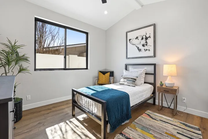A bright secondary bedroom with contemporary design, clean lines, and plenty of natural light—ideal for guests, children, or a stylish home office.