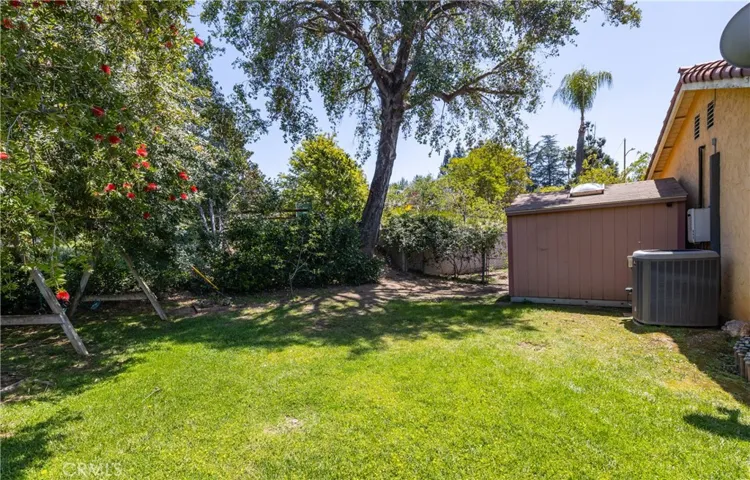 rear sideyard with storage shed