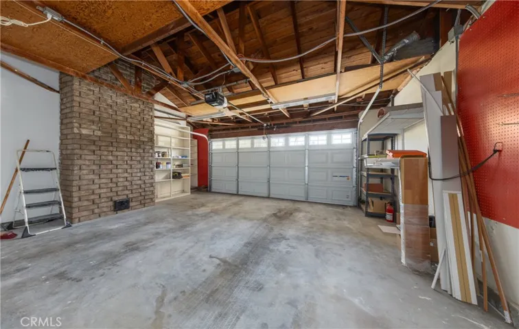 2 car attached garage; newer roll up door and battery back up opener