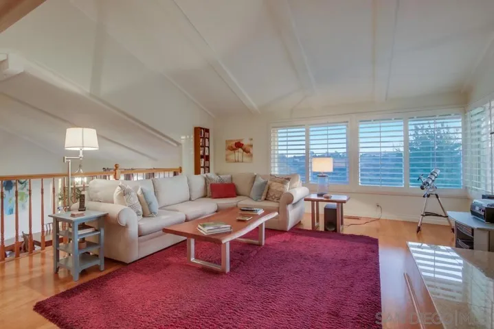Spacious living room with wall-to-wall windows for more amazing views!