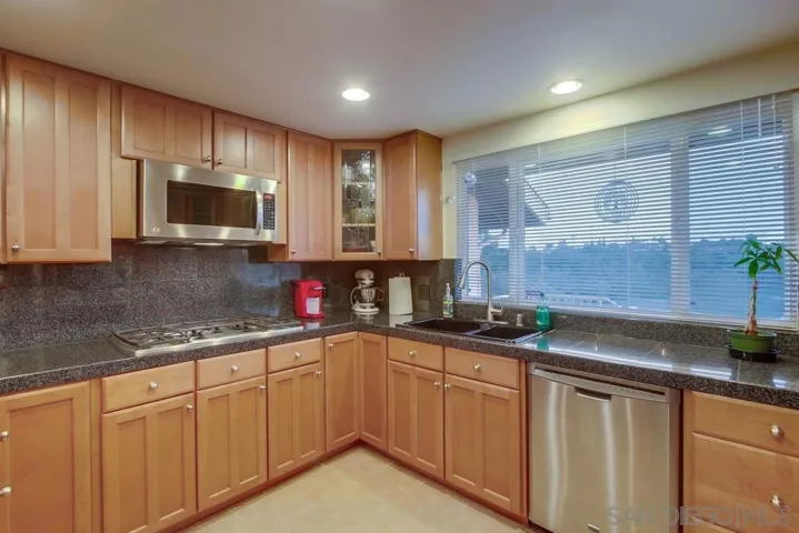 Granite counters, custom cabinetry, and loads storage!