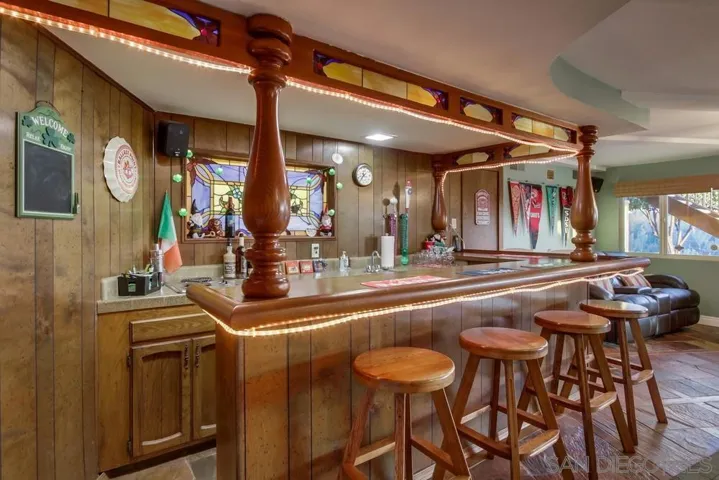 Custom bar with stain glass touches-great area to kick back and entertain with friends!