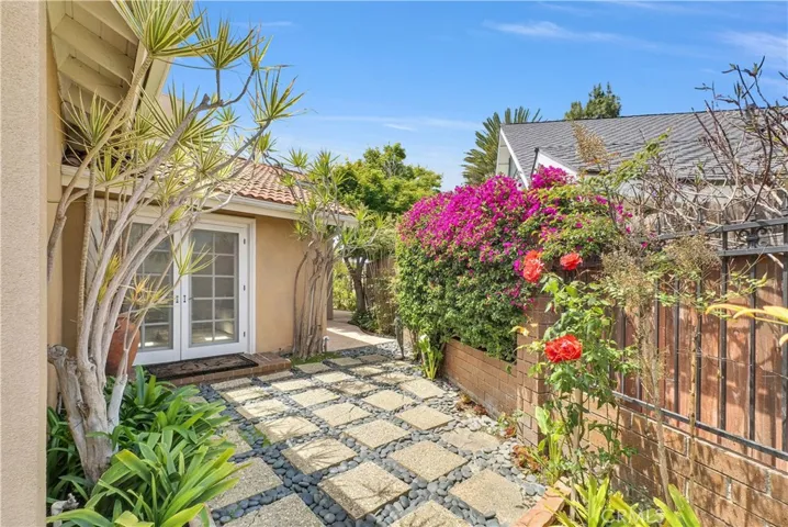 French Doors from Downstairs Primary River opens to the Private Gated Courtyard