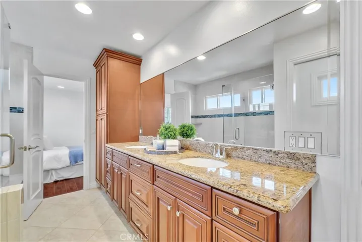 Jack & Jill Bathroom Upstairs with Granite Dual-Sinked Vanity, Shower, and Separate Tub, Plus Privacy Toilet