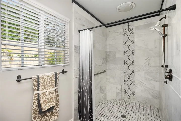 Main floor beautiful marble ADA designed shower.