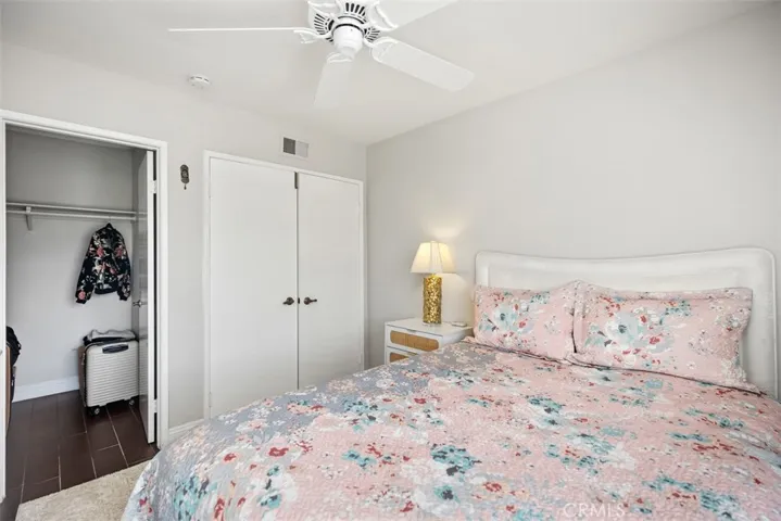 Guest room with a nice size walk in closet.