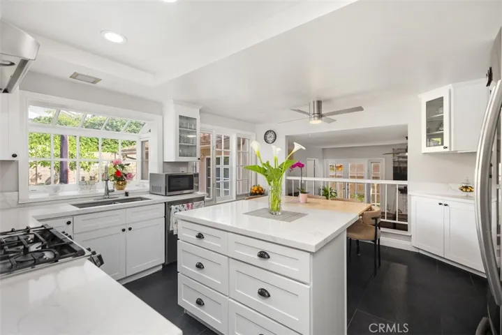 Beautiful remodeled kitchen with quartz countertops & custom cabinetry.
