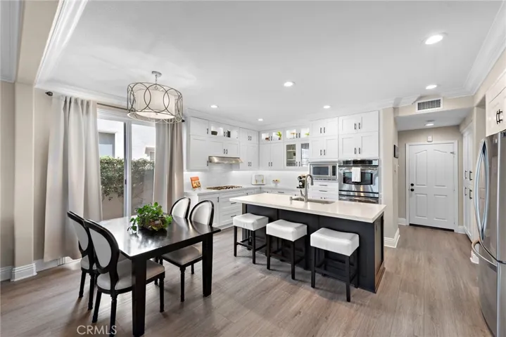 Remodeled Kitchen with quartz counter tops and handcrafted cabinets from floor to ceiling and are all soft closing.