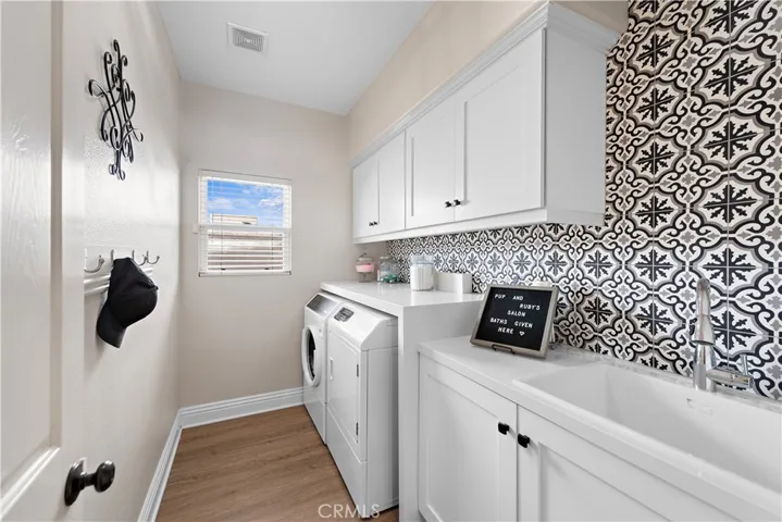 Remodeled laundry room with quartz countertops and large soaking tub, great for washing small/medium dogs