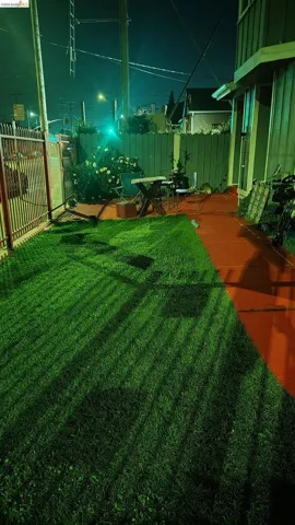 Yard at twilight with a patio area