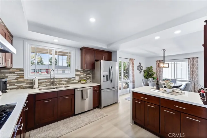 The large window above the kitchen sink provides great views of the neighborhood and allows natural light to flood the space.