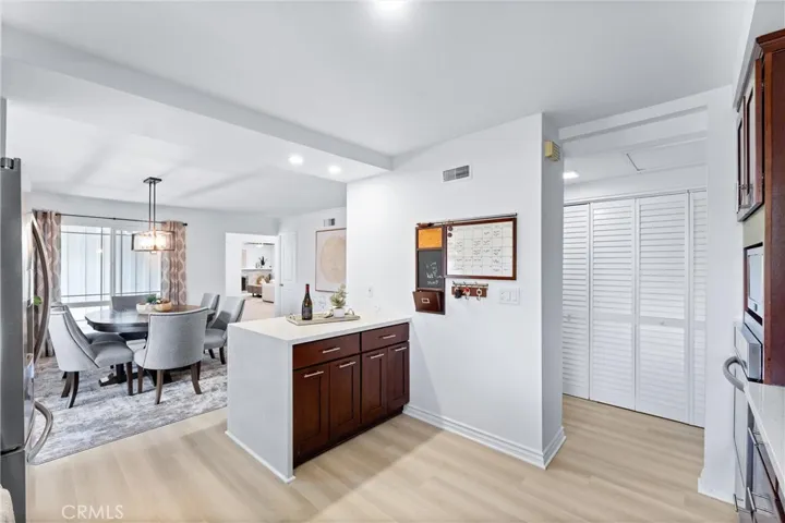 Kitchen opens to the dining room and has a breakfast bar with seating.