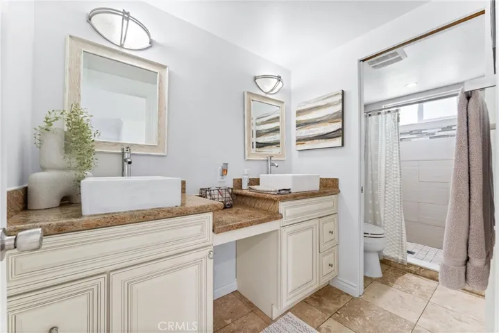 Bathroom #2 has been remodeled and has dual sinks and the toilet and shower area are in a separate room.