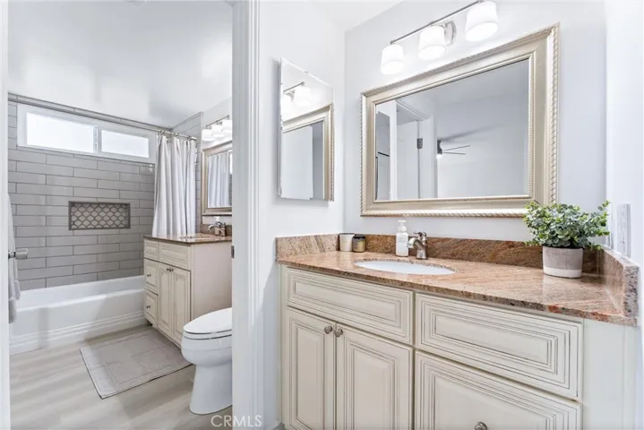 Primary En Suite has dual sinks, tub/shower combo, and new LVP flooring and paint.