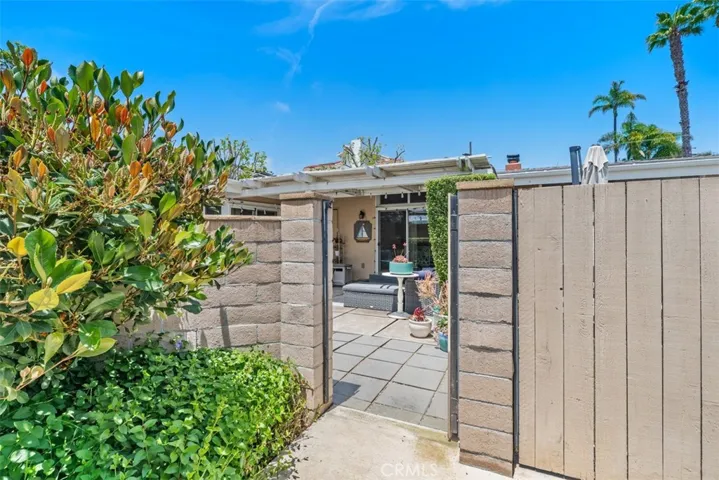 gate in backyard to complex green belt