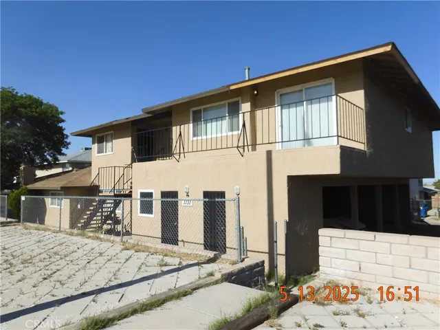 Front of the property, looking NE from the SW corner of the building